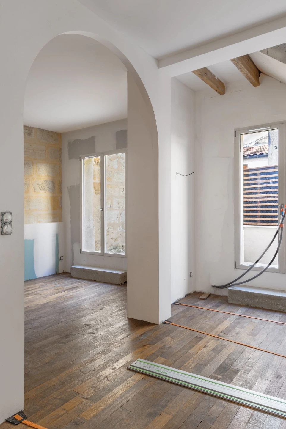 Photo suivi chantier charpentier BTP Bordeaux — Intuitio Studio